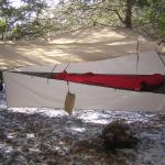 
Fly and Skirt tied out as side porch.  Gear can be hung at various spots around the perimeter, and is even somewhat weather-protected just laying under the tent's footprint.